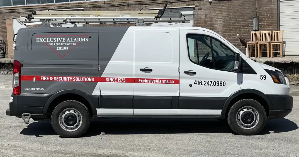Ford Transit Partial Van Wrap for Exclusive Alarms - After - Side View Ford Transit Partial Van Wrap for Exclusive Alarms - After - Side View