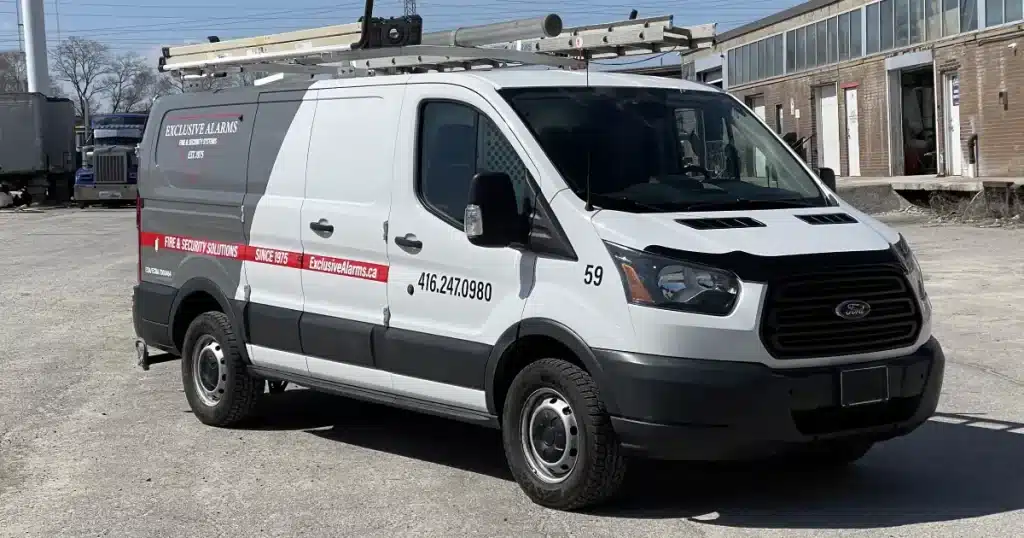 Ford Transit Partial Van Wrap for Exclusive Alarms - Angle Side Ford Transit Partial Van Wrap for Exclusive Alarms - Angle Side