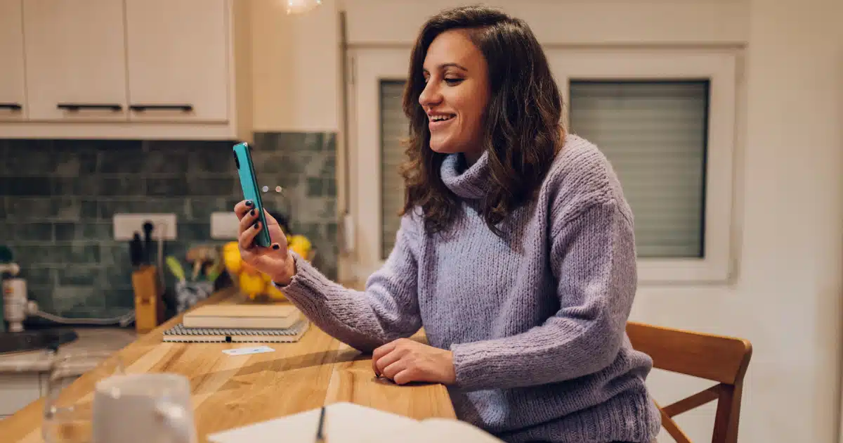 working from home woman looking at social media to optimize her website and digital marketing