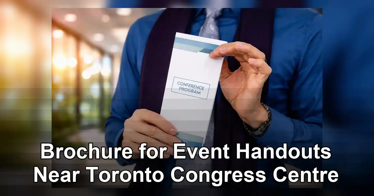 brochure for event handouts near toronto congress centre — Close-up of hands holding a conference program indoors, showcasing