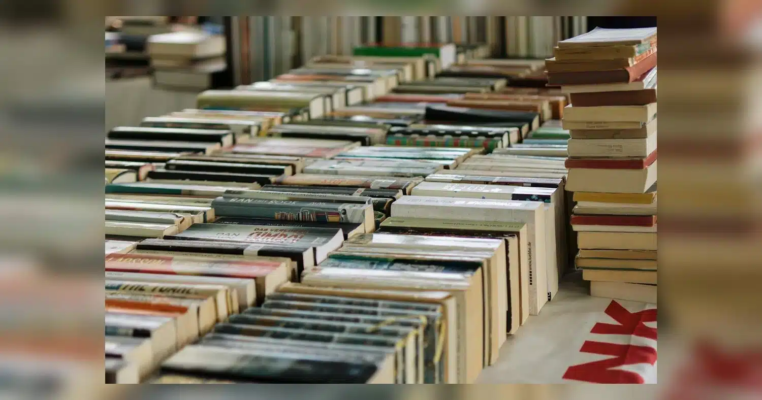 Custom Book Printing — Wide view of numerous books neatly arranged at a book market, showcasing variety and abundance.