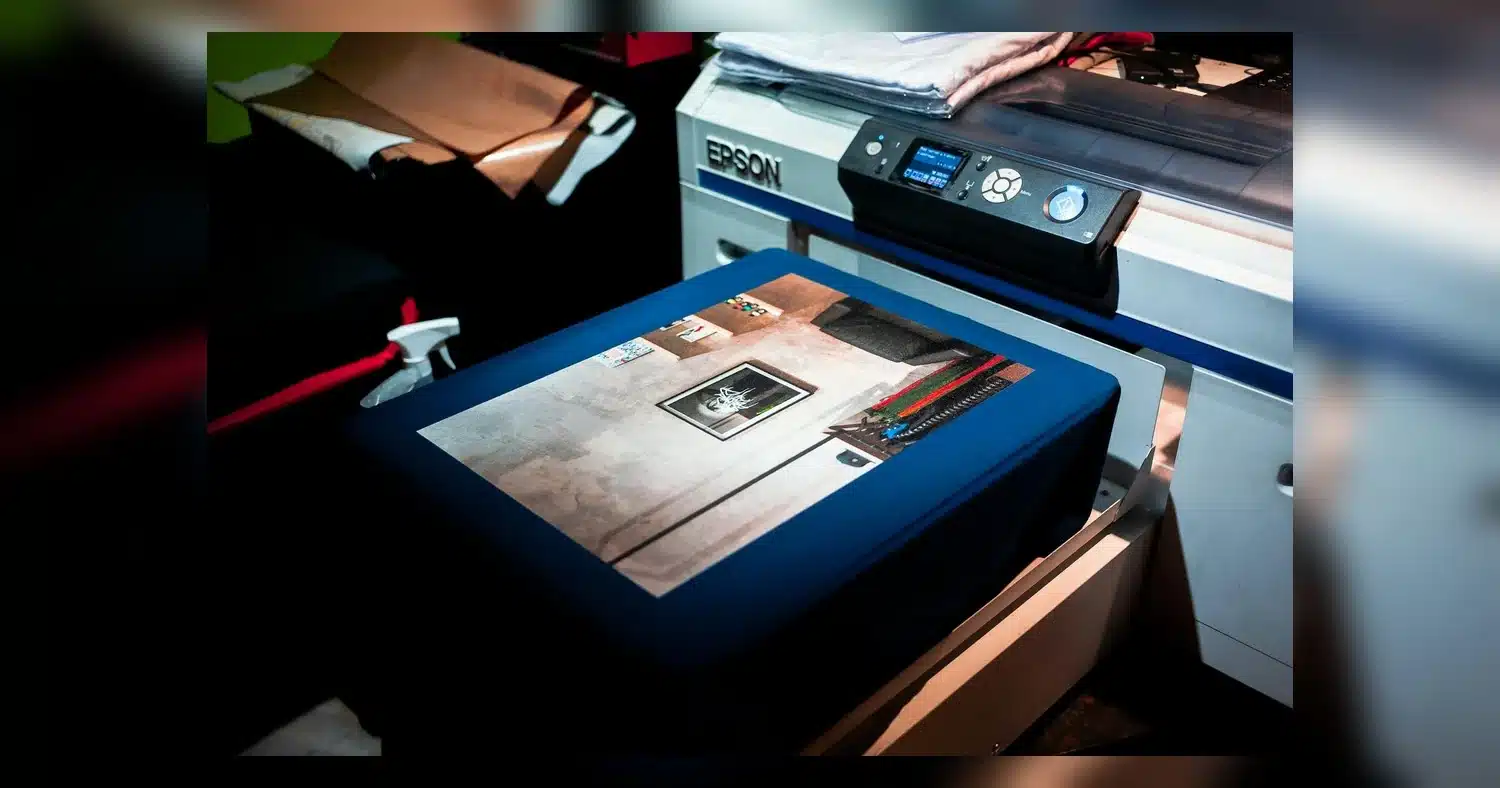 same-day printing near humber college — Close-up of a professional printer printing a custom artwork design on fabric in a st