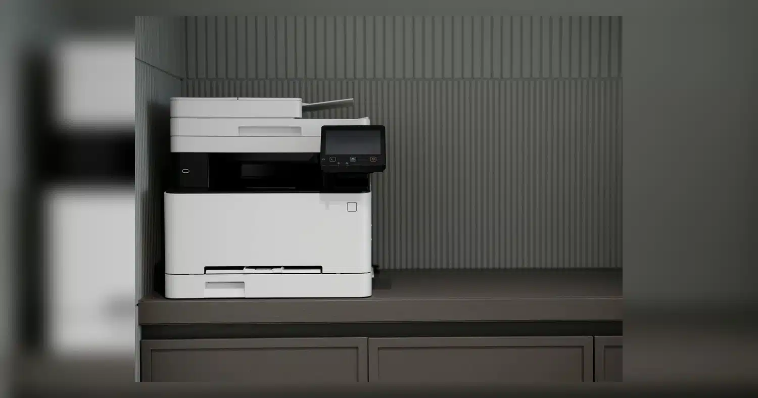 best printing near humber college — A sleek, modern printer situated on a minimalist office desk with a textured background.