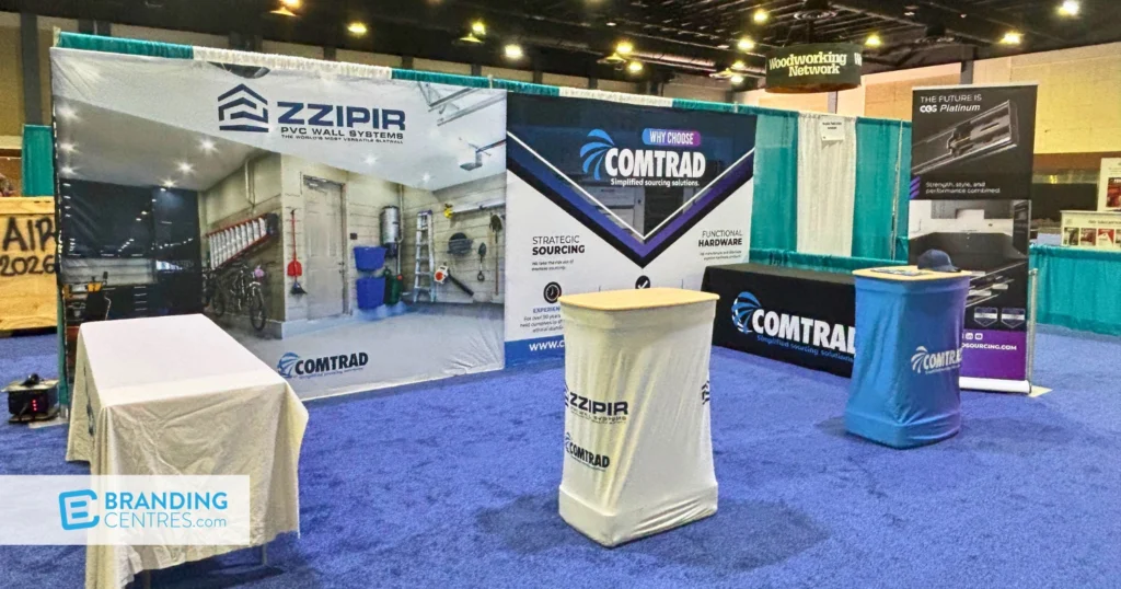 Why Choose Comtrad tension-fabric backdrop wall with a branded table throw and CGS Platinum retractable banner stand at a trade show