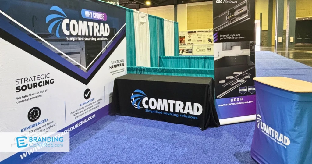 Why Choose Comtrad tension-fabric backdrop wall with a branded table throw and CGS Platinum retractable banner stand at a trade show