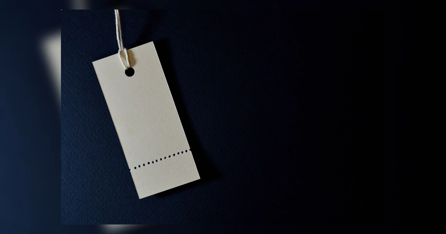 custom apparel quote etobicoke — Elegant minimalist card with a string, ideal for labeling or pricing against a black backgro
